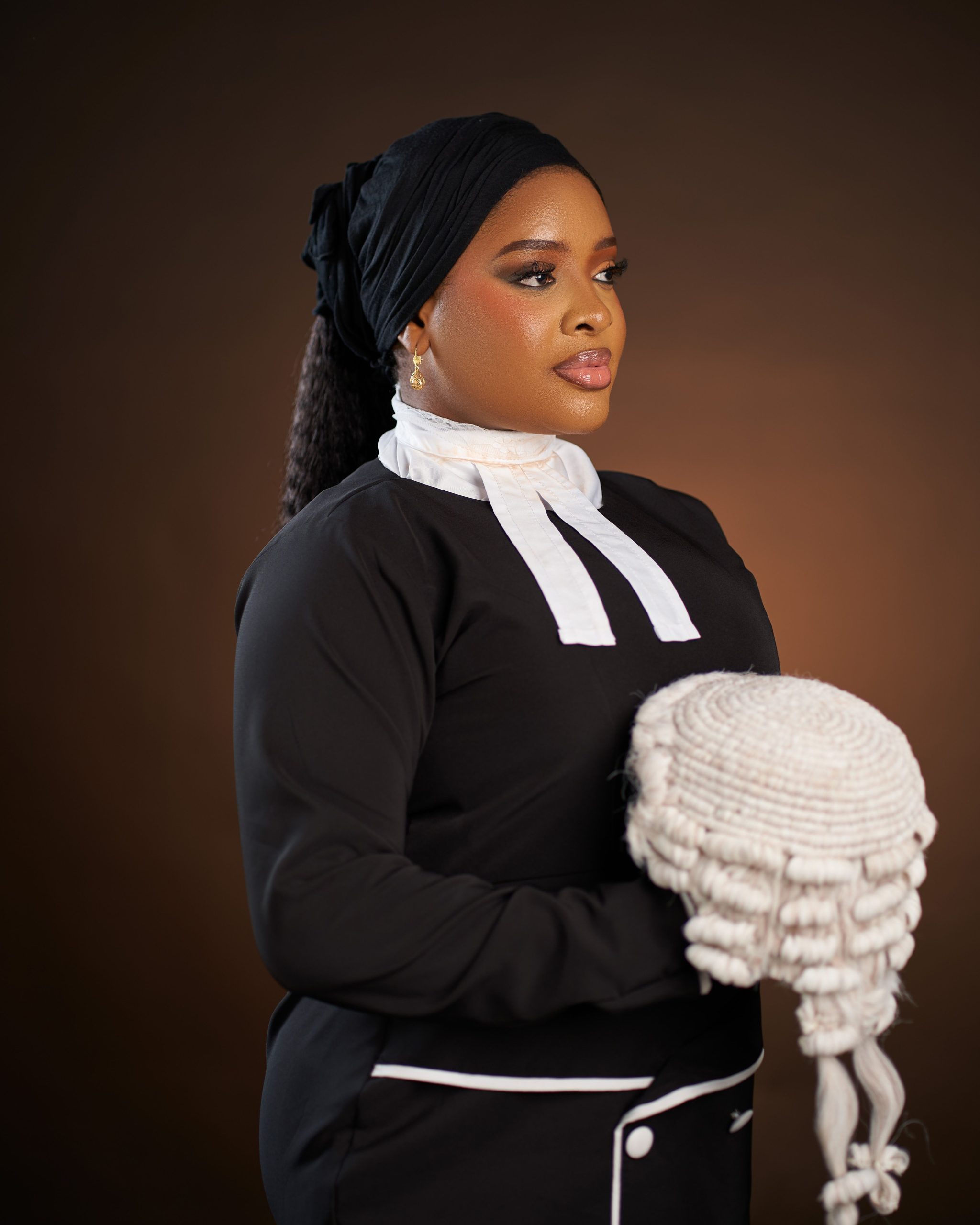 Elegant portrait of a female lawyer with a wig, symbolizing justice and professionalism.